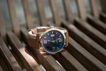 Wristwatch on a wooden chair