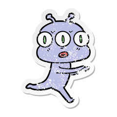 distressed sticker of a cartoon three eyed alien