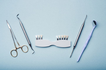 Dental equipment on light blue background