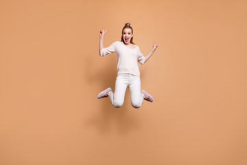 Fototapeta na wymiar Full length body size view portrait of her she nice crazy careless childish attractive glamorous cheerful straight-haired girl wearing white sweater showing v-sign isolated on beige pastel background