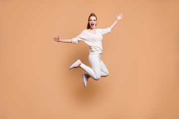 Fototapeta na wymiar Full length body size view portrait of her she nice careless attractive glamorous cheerful cheery straight-haired girl wearing white sweater good day isolated on beige pastel background