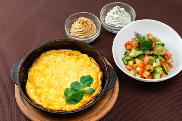 omelet in a pan and food