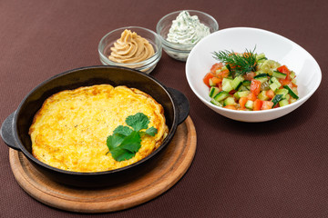 omelet in a pan and food