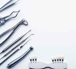 Different shiny metal medical tools on white background