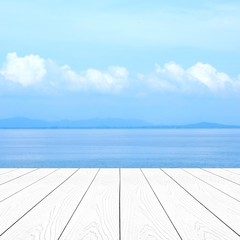 Empty white marble table over blur blue sea and sky in summer background, product display montage background, banner