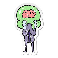 distressed sticker of a cartoon big brain alien crying