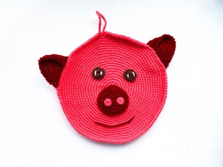 knitted homemade hand-made pig, muzzle of a pig