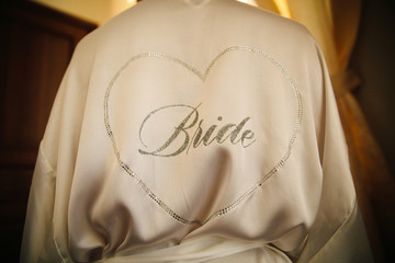The inscription on the back of the girl from rhinestones - the bride