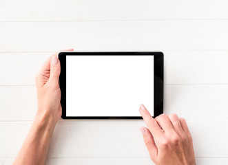 Top view of girl using tablet on white table background
