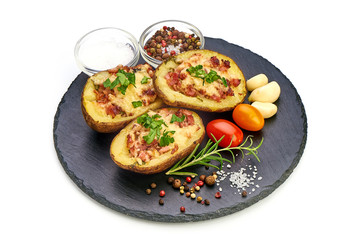 Stuffed baked potatoes with bacon and cheese, close-up, isolated on white background