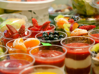 Healthy food on sale, ripe fruit and yoghurt, small portions for kids