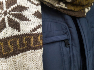 Stylish, fashionable coat and a comfy warm scarf for sale on an shop exibition.