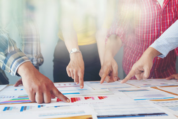 Business people meeting or negotiating a contract and pointing on a document and discussing...