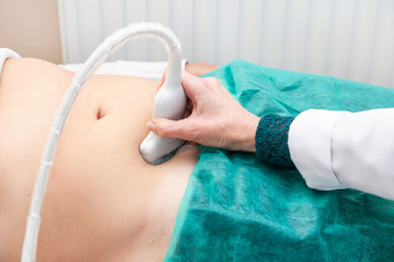 doctor abdominal ultrasound examine clinic patient body hand scanning green test USI waves...