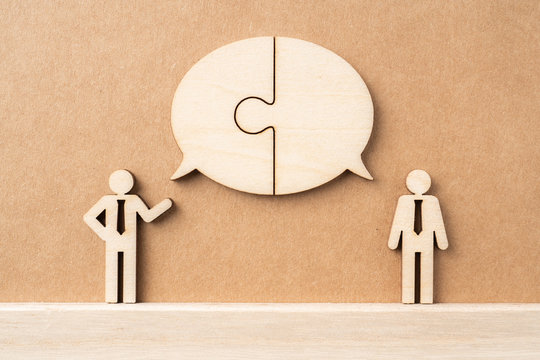 wooden businessman with conversation concept