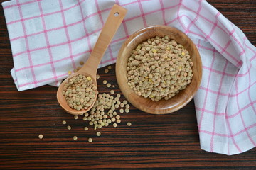 raw brown lentils in a bowl