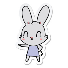Fototapeta na wymiar sticker of a cute cartoon rabbit in dress