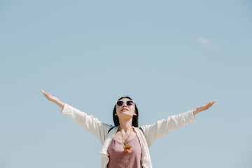 Female tourists spread their arms and held their wings, smiling happily.