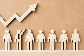 wooden businessman with leadership concept