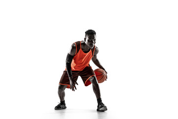 Obraz premium Full length portrait of a basketball player with a ball isolated on white studio background. advertising concept. Fit african anerican athlete with ball. Motion, activity, movement concepts.