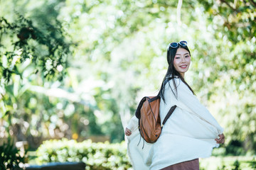 Female tourists spread their arms and held their wings, smiling happily.