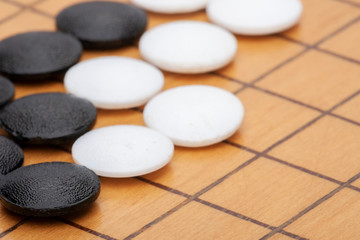 Fototapeta na wymiar Go board,traditional Chinese strategy board game.Game brain training