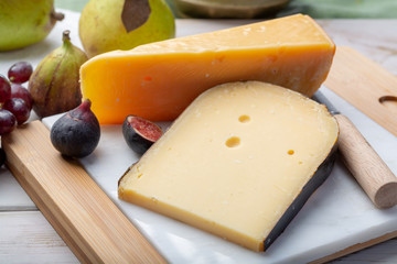 Pieces of aged original Dutch hard cheeses close up