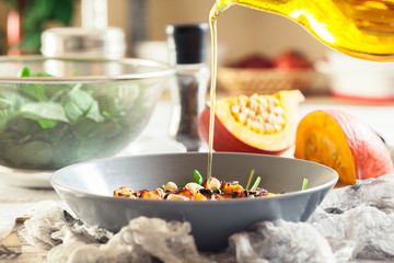 Roasted pumpkin salad with spinach and nuts