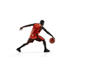 Full length portrait of a basketball player with a ball isolated on white studio background. advertising concept. Fit african anerican athlete with ball. Motion, activity, movement concepts.
