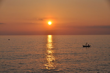 fishing boat at sunset in Camogli, Genoa province, Liguria, Italy