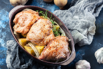 Chicken thighs and potatoes ready for baking