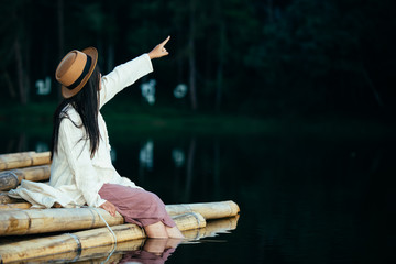 Female tourists spread their arms and held their wings, smiling happily.