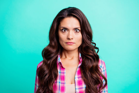 Close up photo beautiful she her lady big full fear eyes oh no face epic fail problem speechless silent quiet wearing casual plaid checkered pink shirt outfit isolated teal bright vivid background