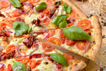pizza with tomatoes and olives