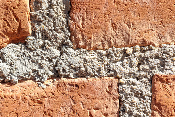 texture of red brick wall in sunlight