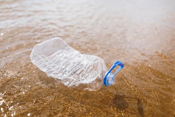 wasted plastic bottle on beach