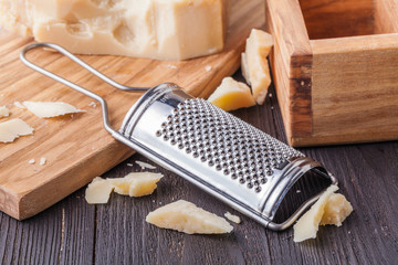 Traditional Italian hard cheese Parmesan and Grana Padano with grater