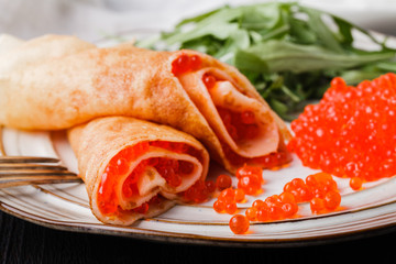 Russian blini - carnival pancakes with red caviar