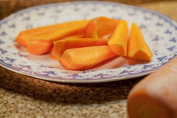 Sliced carrot lies on plate