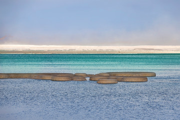 Round salt formations in the turquoise waters of the Dead Sea