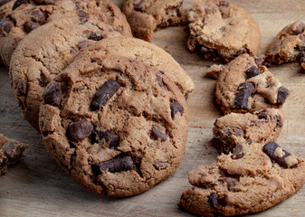Fototapeta premium Chocolate chip cookies on wooden Background, copyspace, top view
