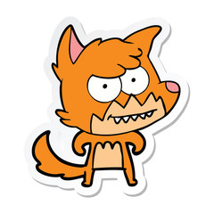 sticker of a cartoon grinning fox