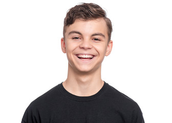 Handsome Teen Boy in black T-Shirt. Portrait of caucasian Smiling Teenager isolated on white background. Happy child looking at camera.