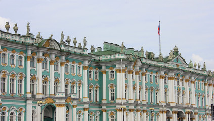 Winter Palace building facade at Palace square in Saint Petersburg, Russia. Old historical city landmark exterior view outdoors with classic pillars, sculptures and decorative elements