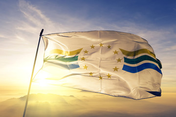 Los Rios region of Chile flag waving on the top sunrise mist fog