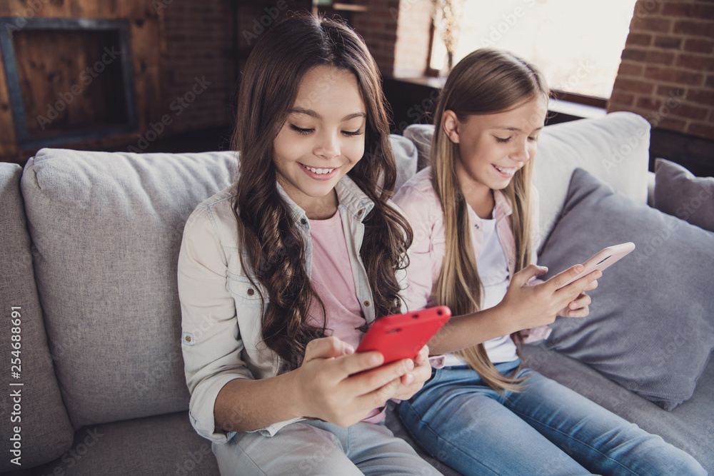 Sticker portrait of two nice cute sweet lovely attractive charming cheerful cheery confident girls sitting o