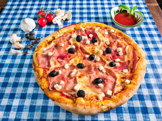 Feta cheese and ham pizza with olives