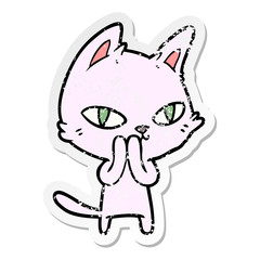 distressed sticker of a cartoon cat staring