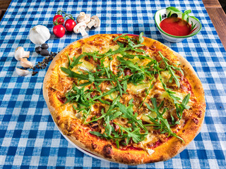 Four cheese pizza with arugula