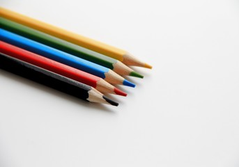 color pencils on white background top and side view